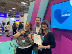 WASHCO CEO presents care home group winners with award